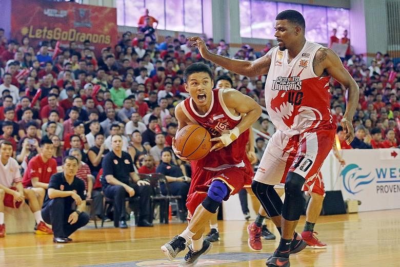 Slingers' Kris Rosales driving past Dragons' Calvin Godfrey in Game 5 of the Asean Basketball League Finals. While lacking stature and financial power, the eight-year-old ABL has much growth potential.