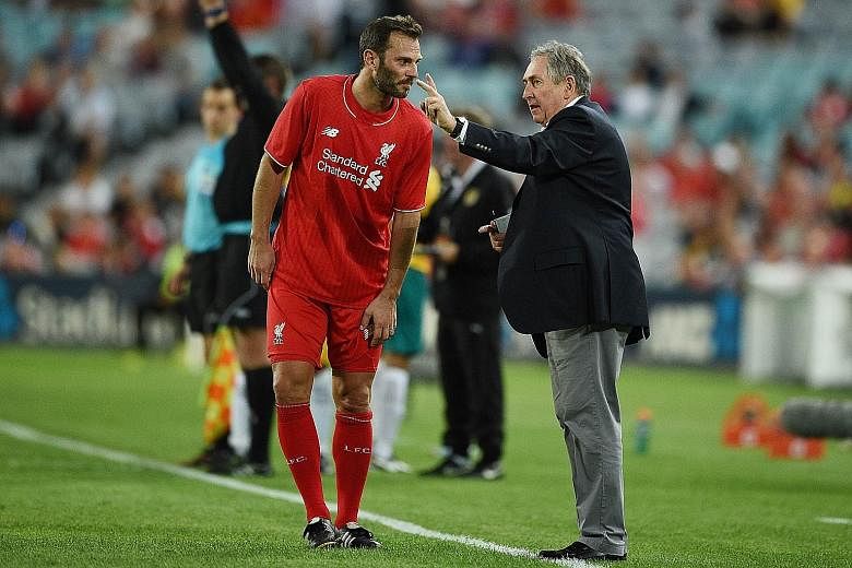 Gerard Houllier at his last public outing, with former Liverpool player Patrik Berger during Liverpool Legends' exhibition game against Australian Legends in January in Sydney. The Frenchman is performing his ambassador role at Tampines for free.