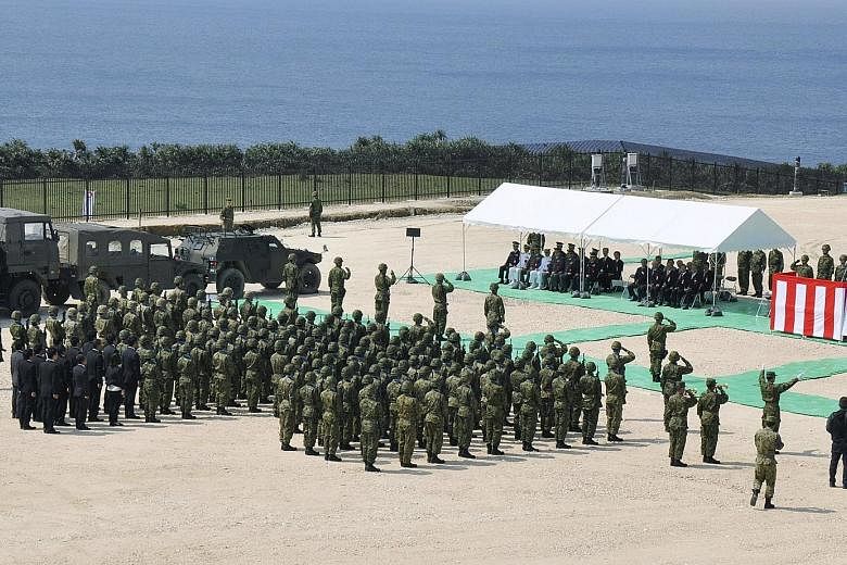 Japan's forces holding an opening ceremony at the new base on Yonaguni Island yesterday.