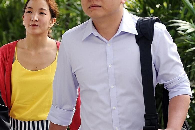 Yang and his wife Takagi arriving at the State Courts yesterday. Takagi was sentenced to 10 months in jail last week, while Yang has pleaded not guilty to seven counts of publishing seditious articles.