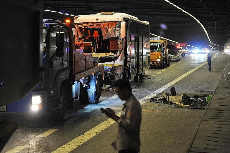 The windscreen of the bus was smashed after it collided with a tipper truck on the Marina Coastal Expressway tunnel yesterday evening. The police are investigating the accident.