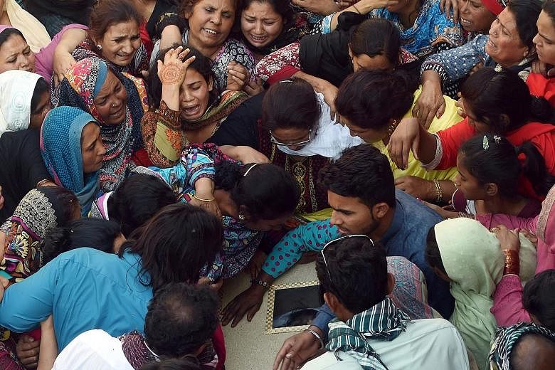 Pakistani Christians at a funeral for a victim of the March 27 suicide bombing, in Lahore, on Monday. The bomber, targeting Christians, killed 73 people, including children, in a crowded park.