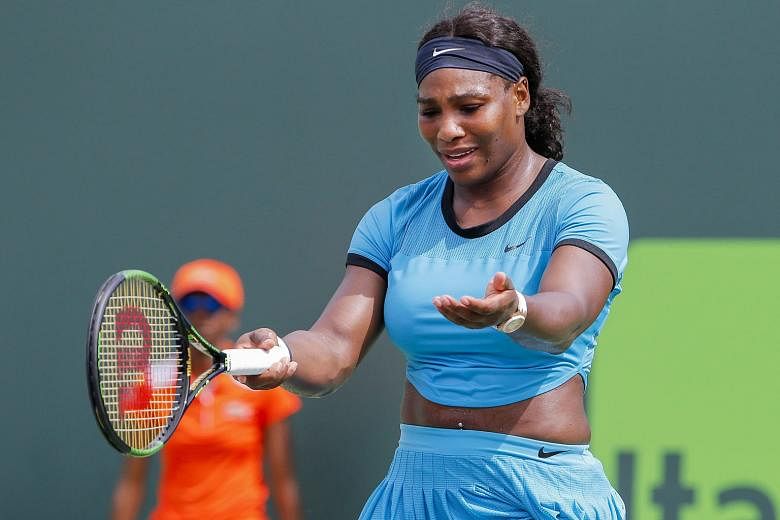 Serena Williams shows her frustration during her 6-7 (3-7), 6-1, 6-2 defeat at the hands of Svetlana Kuznetsova in the fourth round of the Miami Open, a tournament she has won the last three years.