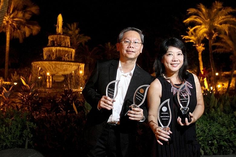 Straits Times night editor Lim Chuan Huat (far left) and deputy picture editor Wang Hui Fen at the Asian Media Awards ceremony in Manila last night. The awards, organised by Wan-Ifra, attracted 462 entries from across Asia. ST bagged a gold medal for
