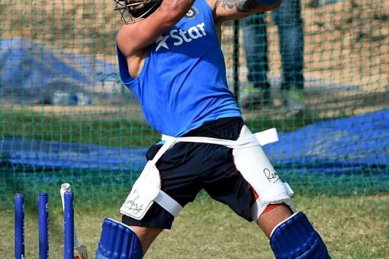 Danger men Virat Kohli (above) of India, batting in the nets during training, and West Indies' Chris Gayle are likely to be their respective sides' key men in the semi-final clash in Mumbai today. 