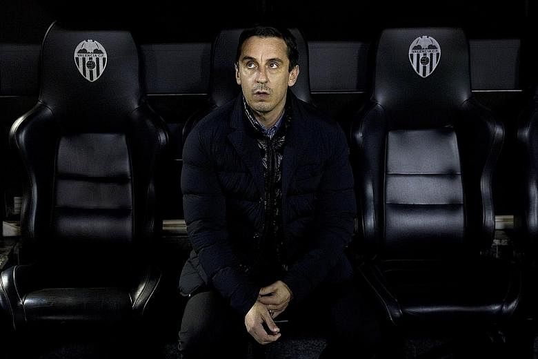 A forlorn-looking Gary Neville in the dug-out during the King's Cup semi-final second leg, where a 1-1 home draw saw Valencia thrashed 8-1 on aggregate by Barcelona.