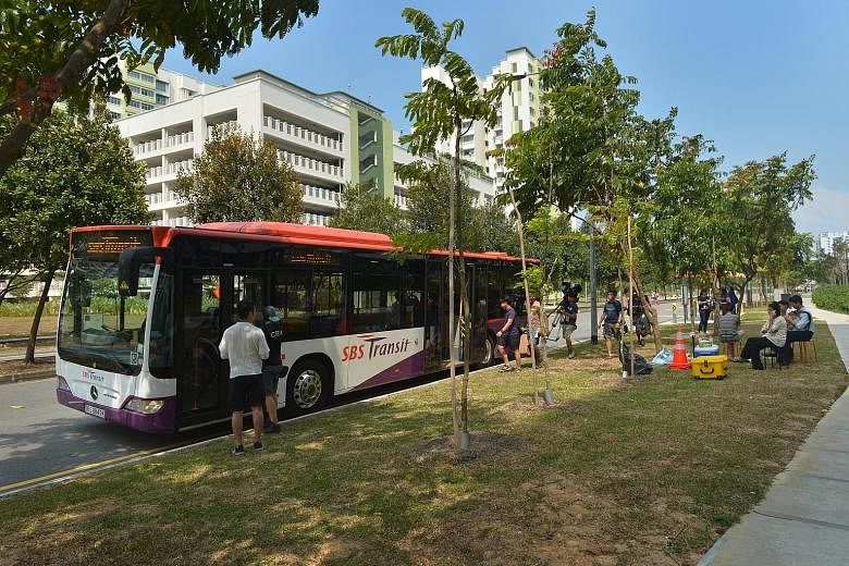 An SBS Transit bus mounted with a camera on the driver's side for the shooting of LTA's new promotional video.