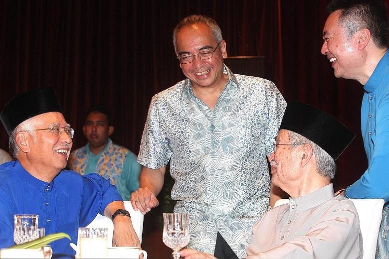 From left: Mr Najib, Mr Nazir, former Malaysian PM Abdullah Ahmad Badawi and his son Kamaluddin Abdullah at a Hari Raya event last year.