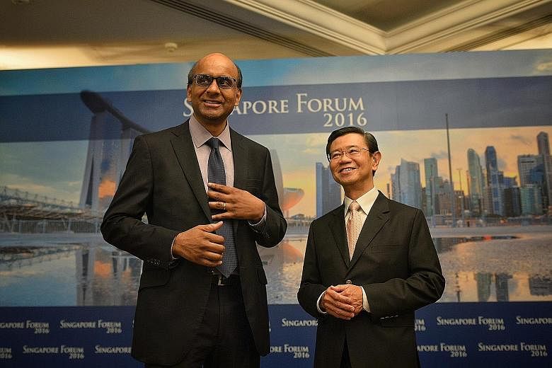 DPM Tharman with former DPM Wong Kan Seng at the Singapore Forum attended by about 250 business leaders, politicians and thought leaders. Mr Wong chairs the forum's advisory board. Mr Tharman, who elaborated on the productivity situation in Singapore