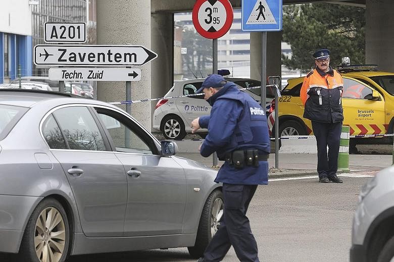 Police checking vehicles at the entry to Brussels Airport. A police union chief in Belgium has warned of a serious security problem at the airport, citing systematic security flaws and the employment of baggage handlers with criminal records.