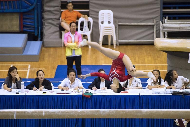 Togawa Mei performing on the balance beam at the Bishan Sports Hall yesterday. The 15-year-old won four Girls' B Division individual golds and finished second in the individual all-around event at the National Inter-school Artistic Gymnastics Championship