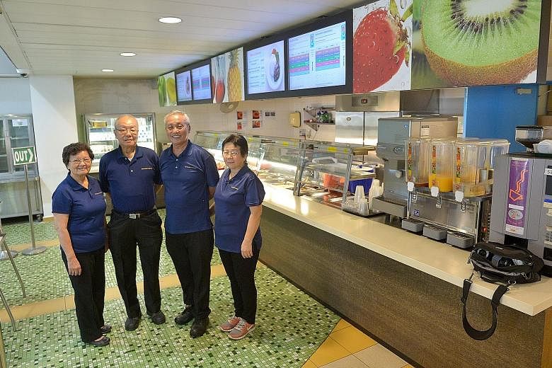 For half a century, Mr Hoe Juan Jok, 68 (second from right) has kept the running of the SAS' cafeterias in the family, including (from left) his sister Hoo Juan Ang, his brother Hoe Juan Sim and his wife Chua Kim Lan. And they have no intention to re