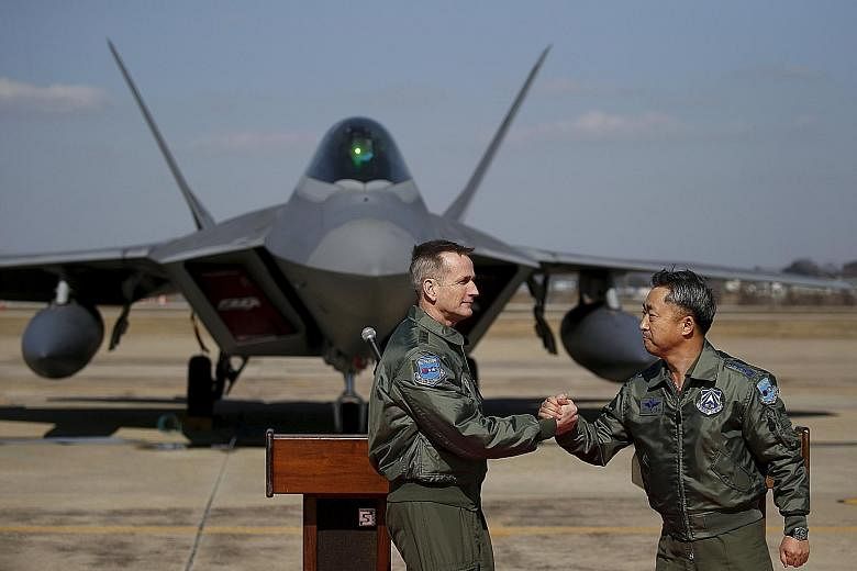 US Forces Korea's Lieutenant-General Terrence O'Shaughnessy (left) with South Korean air force commander Lee Wang Geun at Osan Air Base in Pyeongtaek, South Korea, in February. The US spends an estimated US$10 billion annually on bases in Japan and S