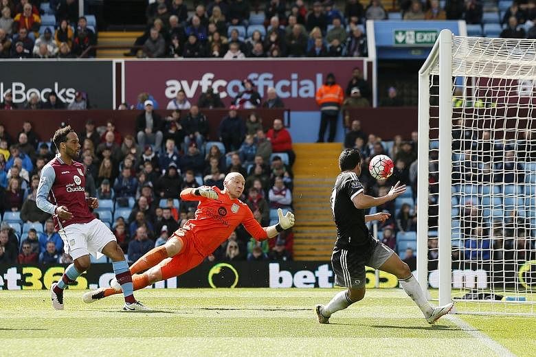 Aston Villa goalkeeper Brad Guzan flapping the ball into the path of Pedro Rodriguez (right), who shoots into an empty net from a narrow angle for Chelsea's fourth goal.