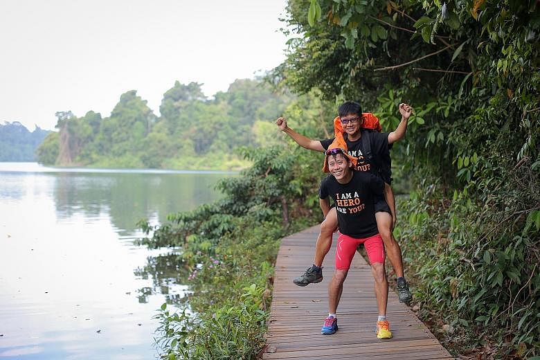 Mr Lin, a Bone Marrow Donor Programme ambassador, carrying Mr Ng, his hiking partner. They are aiming to complete the 1,000km route across the Bibbulmun Track in Australia in 20 days to raise awareness for the programme.