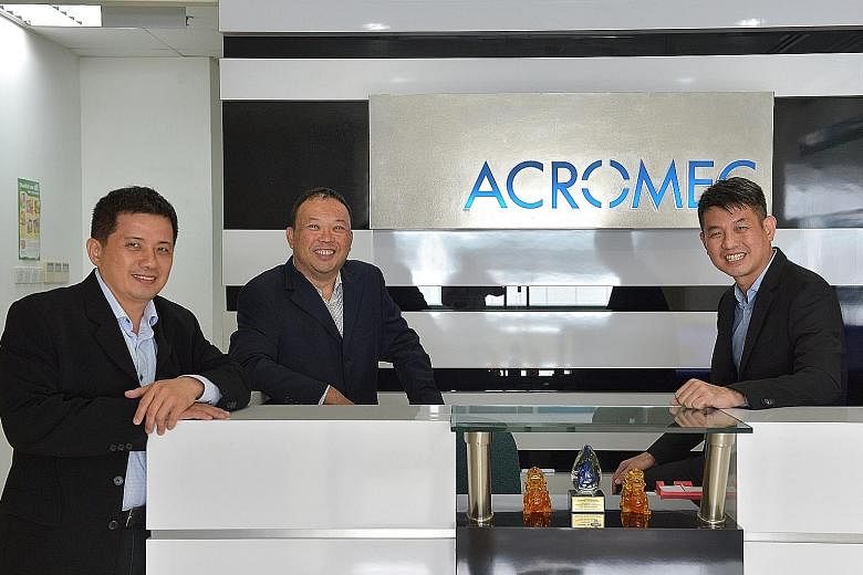 (From left) Acromec director Desmond Chew, Mr Lim, managing director, and Mr Goi, director. The engineering services provider specialises in designing and building facilities that require controlled environments, such as clean rooms and laboratories,