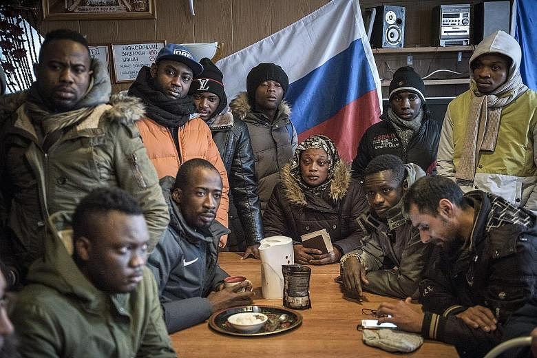 Migrants from African countries at a hostel in Kandalaksha, Russia, waiting to cross into Finland. The use of the Arctic route to the EU by refugees and migrants has added anxiety, not to mention intrigue, to a crisis that is tearing the bloc apart.