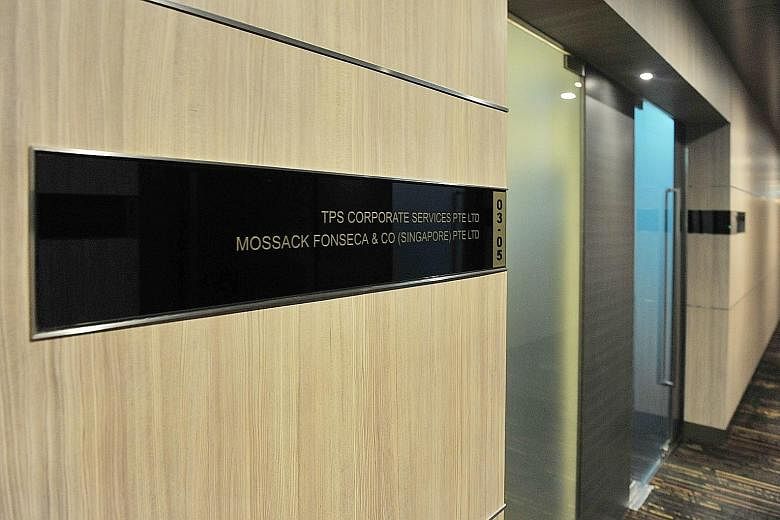Mr Mossack (top) and Mr Fonseca of Mossack Fonseca. "We are going to make ourselves the right size - smaller," Mr Fonseca said during a four-hour interview on March 29. Below: The Mossack Fonseca office in Singapore, in Keppel Road.