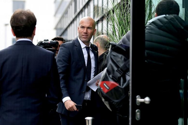 Real Madrid manager Zinedine Zidane arriving at the team's hotel yesterday. His side are the clear favourites to win their Champions League match against Germany's Wolfsburg today.