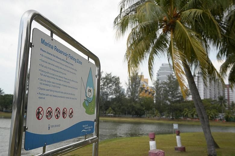 A notice board informing anglers about responsible fishing is seen at a designated fishing area along the Kallang River, where a wild otter pup was spotted last Saturday with a fish hook near its eye.
