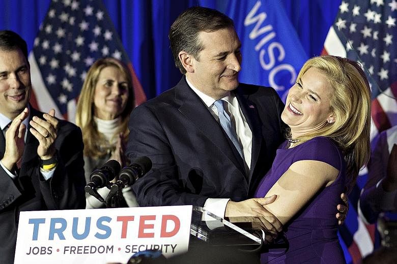 Democratic presidential candidate Bernie Sanders celebrating his victory in Wisconsin. Experts had predicted his win because of the state's open primary rules, large white population and young progressive electorate. Senator Ted Cruz with his wife He