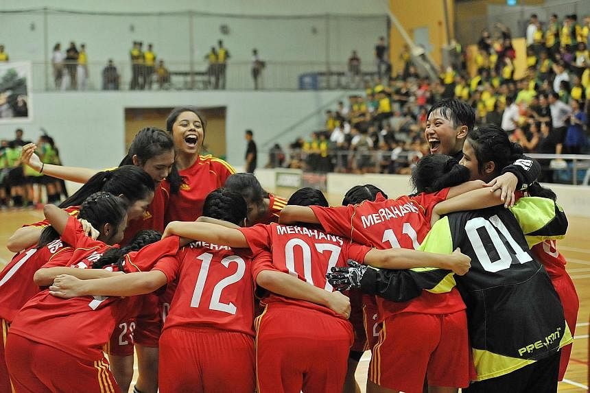 From top: The Bukit Merah B girls' team celebrating after beating Orchid Park 10-3 for a record seventh divisional title. Victoria's Tan Ding Feng in control against East View's Veerasenan Shaaran. Victoria won 3-2 thanks to Adib Norishaam's late win