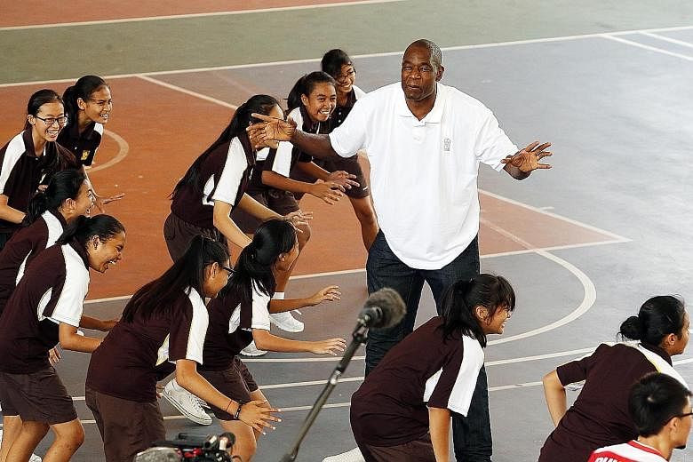 National Basketball Association (NBA) Hall-of-Famer Dikembe Mutombo making practice fun as he conducted a basketball clinic at Dunman Secondary School yesterday. The NBA global ambassador, who is known for his humanitarian work off the court, is in t