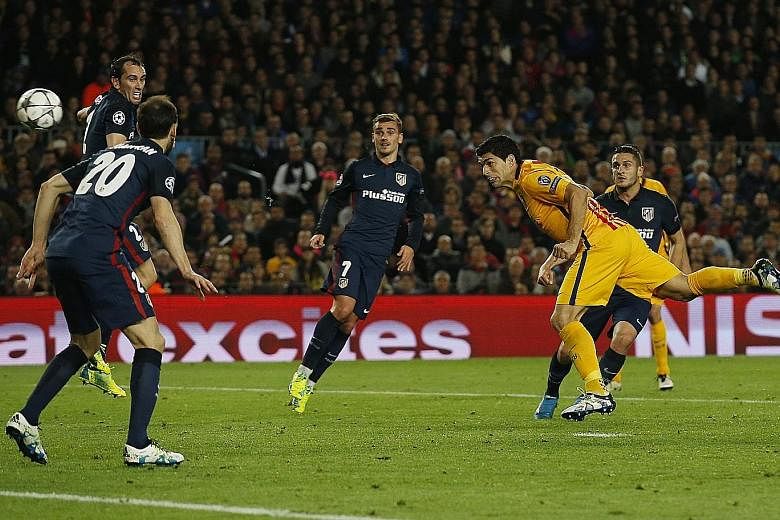 Luis Suarez scoring the second goal for Barcelona at the Nou Camp. Atletico, who played the Champions League match with 10 men for over an hour, say the Uruguayan was lucky to stay on the pitch despite multiple incidents. German referee Felix Brych s