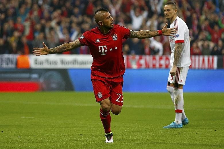 Bayern Munich's Arturo Vidal celebrating after scoring the only goal of their Champions League quarter-final, first-leg match against Benfica at the Allianz Arena.
