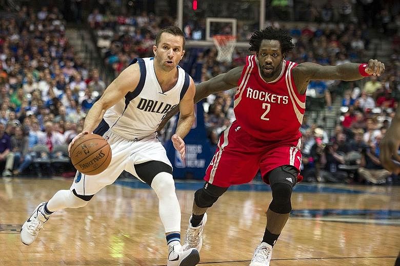 Dallas' J.J. Barea being guarded by Houston's Patrick Beverley. The Mavericks player connected on 10 of 16 shots from the floor.