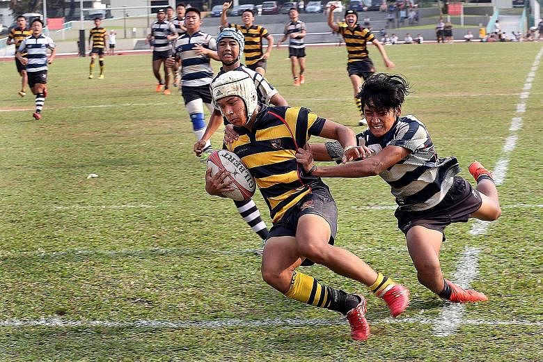 ACS(I) winger Benjamin Poey sprinting past the despairing dive of Saints' stand-off Miguel Erwin Besoro William to seal the title. His side were fired up for the showdown especially after Saints won 22-0 earlier. The Saints had a chance to take the l