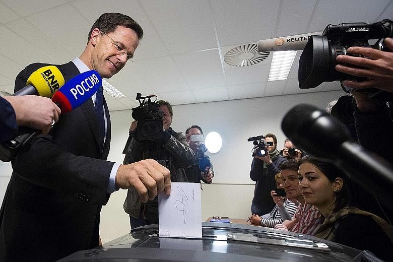 Dutch Prime Minister Mark Rutte casting his vote in the referendum on Wednesday. His Cabinet had campaigned for approval of the pact. He pledged to respect the voters' decision.
