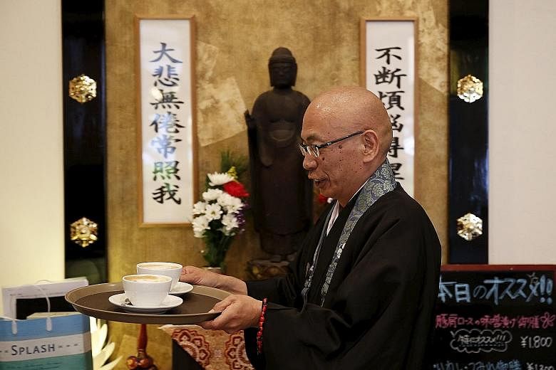 Buddhist monk Shokyo Miura, one of the on-site priests, at Tera Cafe in Tokyo. The cafe is part of a flourishing phenomenon in Japan.