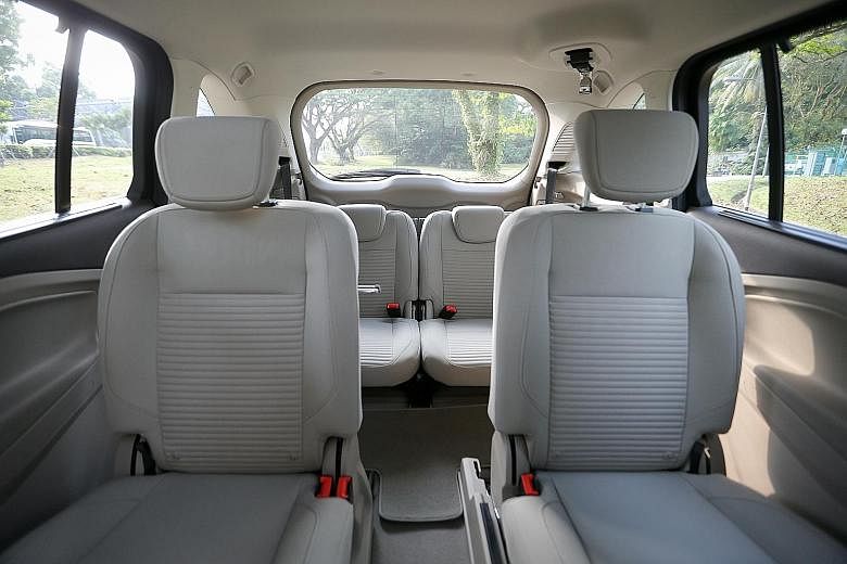 The middle aisle (above) makes the compact C-Max (left) roomier than most MPVs its size.