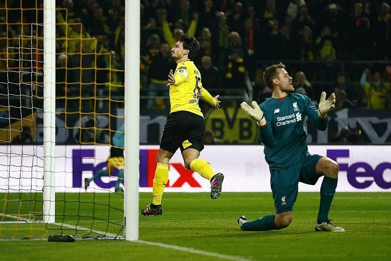 Mats Hummels wheeling away in delight after heading past Liverpool goalkeeper Simon Mignolet for Dortmund's equaliser on Thursday.