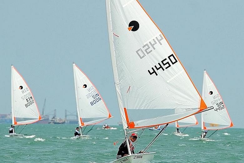 Raffles Institution's Lu Junrui taking part in the Boys' B Division byte races. The 16-year-old produced a perfect score, his first in his eight years of sailing, to clinch the title.