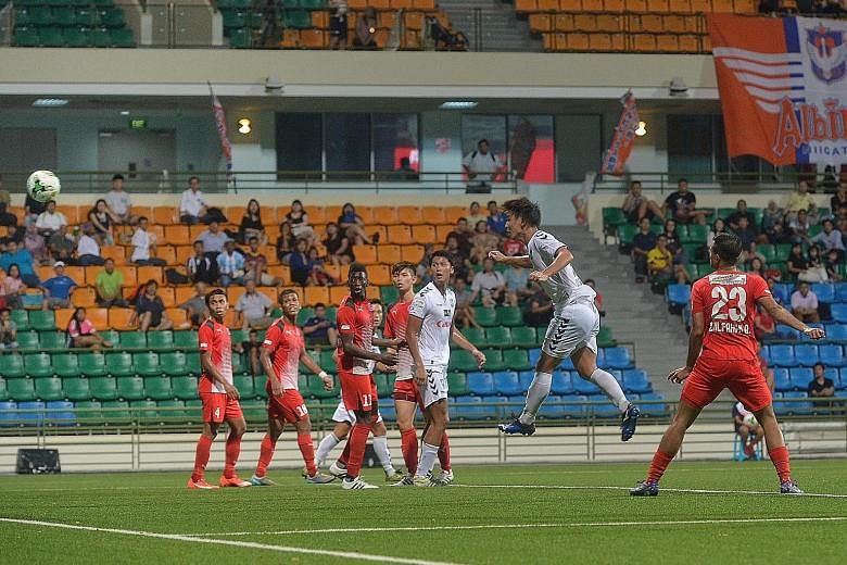 Albirex Niigata's Atsushi Kawata (right) heading in the third goal in their 3-0 win over Home United at the Jalan Besar Stadium last night.
