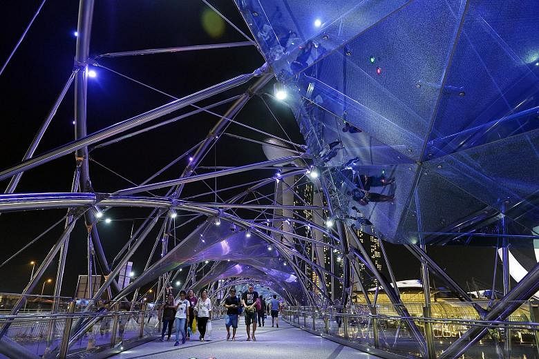 The Helix Bridge is among iconic structures and buildings in Singapore that are being bathed in blue light this month to mark World Autism Awareness Day. Other events being held to showcase the abilities of individuals with the condition include carn