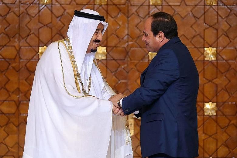 King Salman (left) after being presented with the Nile Collar, Egypt's highest state honour, by President Sisi.