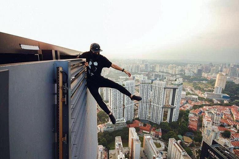 Rooftoppers showing off dangerous stunts, such as hanging precariously off the top and walking at the edge of buildings. Local daredevils climb commercial buildings and new HDB blocks, said one.