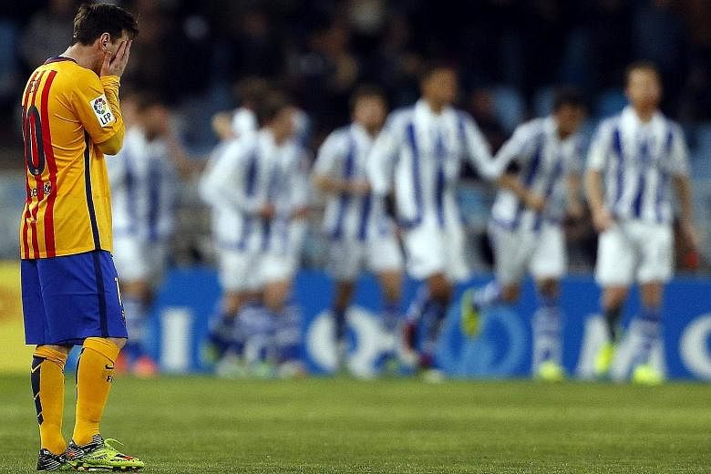 Real Sociedad is turning out to be Barcelona's jinx team after the Spanish and European champions lost away at San Sebastian for the fourth straight season, causing Lionel Messi (left) much despair.