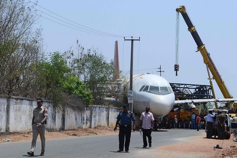 A disused Air India passenger plane fell from a ground transporter while being moved near Begumpet Airport in the Indian city of Hyderabad yesterday. The Airbus A-320 was being moved from the airport to Air India's cadet training facility when the tr