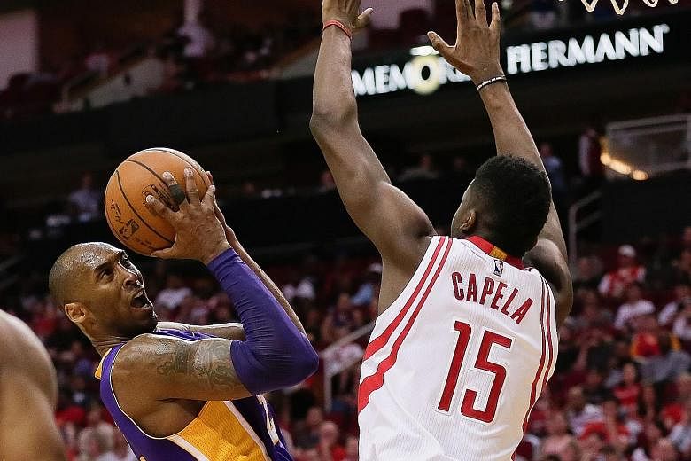 The Lakers' Kobe Bryant (left), guarded by Houston's Clint Capela, said he was not surprised by his form in the 110-130 loss.