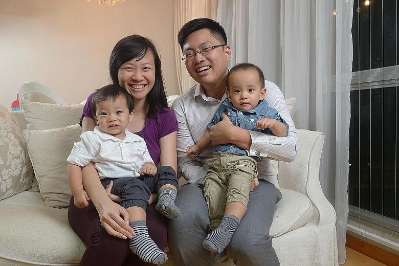 Ms Rachel Lee and Mr Eugene Tan with their twin boys, who were born last year. Mr Tan took a week of paternity leave and a week of Ms Lee's 16-week maternity leave. This was possible because his supervisor was supportive, says Ms Lee.
