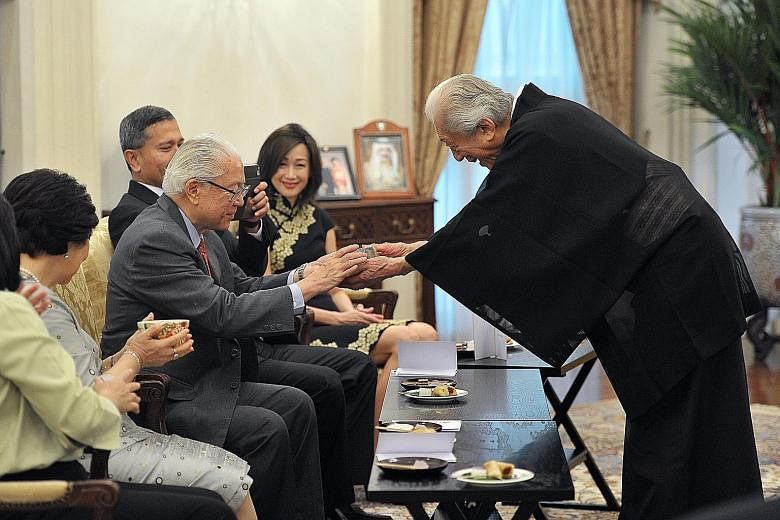Japanese tea ceremony expert and Unesco goodwill ambassador Sen Genshitsu conducting a tea ceremony at the Istana yesterday for President Tony Tan Keng Yam and Foreign Minister Vivian Balakrishnan. Dr Sen, 93, Urasenke Grand Master XV, is the former 