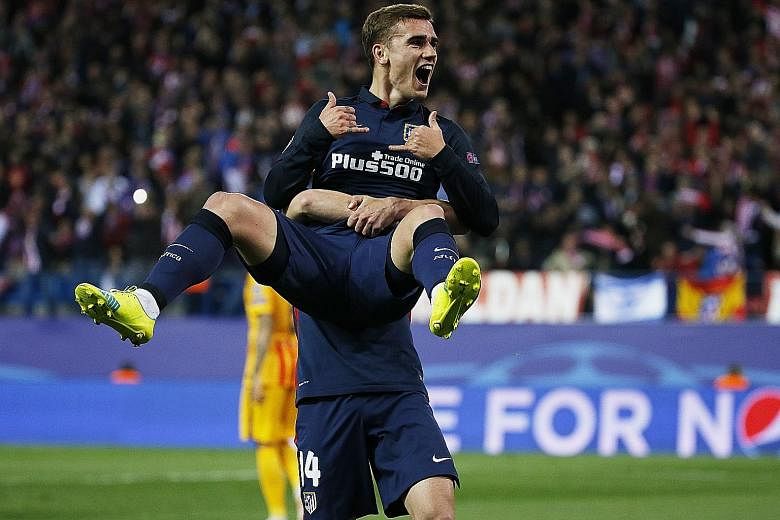 Atletico Madrid's two-goal hero Antoine Griezmann celebrating after scoring his first goal against Barcelona in their Champions League quarter-final, second-leg clash at the Vicente Calderon. Atletico won 2-0 and progressed 3-2 on aggregate.
