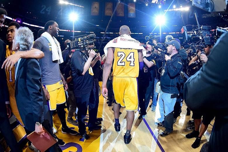 Kobe Bryant of the Los Angeles Lakers walks towards the tunnel for the last time in his 20-year NBA career after scoring 60 points in the tense 101-96 victory against the Utah Jazz on Wednesday.