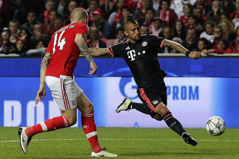 Benfica's Victor Nilsson-Lindelof (left) is powerless to prevent Bayern Munich's Arturo Vidal from equalising during their Champions League quarter-final second-leg 2-2 draw on Wednesday.