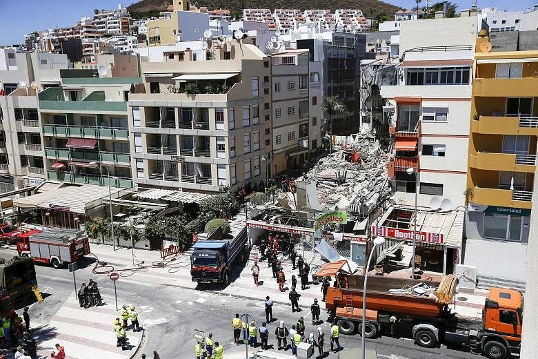 Rescue workers searching for survivors on Thursday after a building collapsed in the beach area of Los Cristianos on Tenerife. It is unclear what caused the collapse.