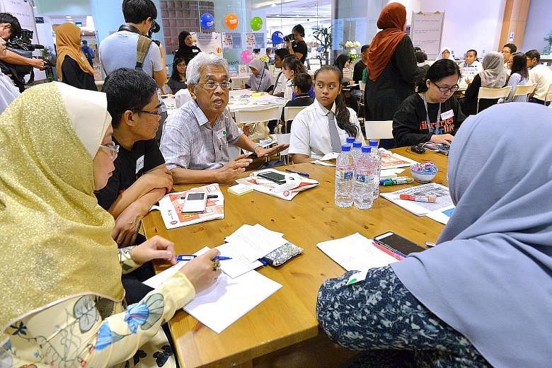 Former Muis president Maarof Salleh (centre) addressing other participants at the SGFuture engagement session at Bedok Public Library yesterday.